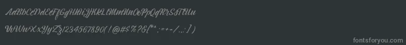 Fonte Montagne Script Free Demo – fontes cinzas em um fundo preto