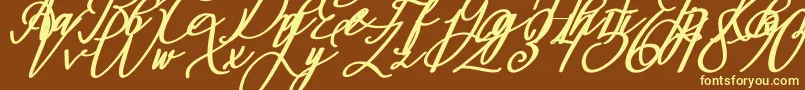 Montapallier BOLD ITALIC-fontti – keltaiset fontit ruskealla taustalla