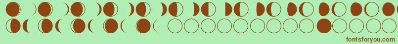 フォントmoon phases – 緑の背景に茶色のフォント