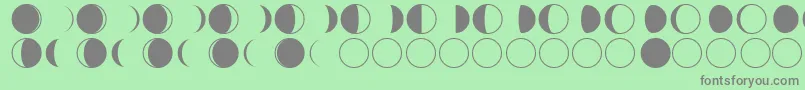 フォントmoon phases – 緑の背景に灰色の文字