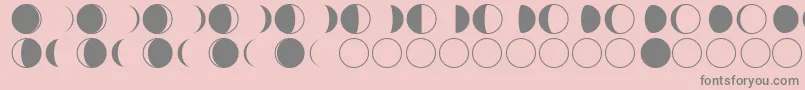 moon phases-fontti – harmaat kirjasimet vaaleanpunaisella taustalla