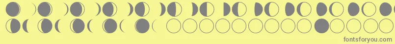 moon phases-fontti – harmaat kirjasimet keltaisella taustalla