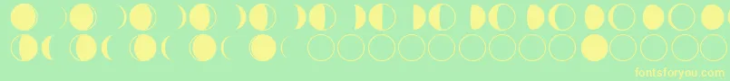 フォントmoon phases – 黄色の文字が緑の背景にあります