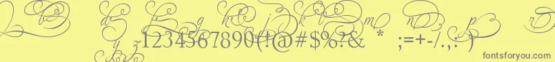 フォントAdiosScriptAltIvAndOrns – 黄色の背景に灰色の文字