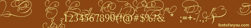 AdiosScriptAltIvAndOrns-fontti – keltaiset fontit ruskealla taustalla