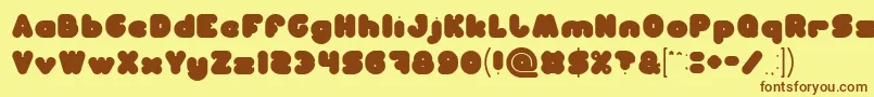 フォントMOONLIGHT – 茶色の文字が黄色の背景にあります。