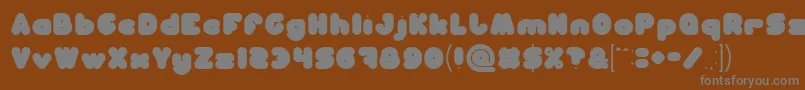 MOONLIGHT-fontti – harmaat kirjasimet ruskealla taustalla