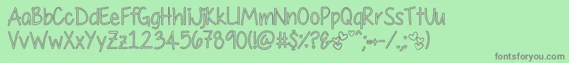 MyFirstCrushHollow Font – Gray Fonts on Green Background