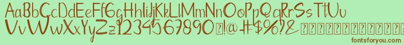 Moontea Family Font – Brown Fonts on Green Background