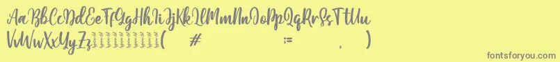 Moshinta-Schriftart – Graue Schriften auf gelbem Hintergrund