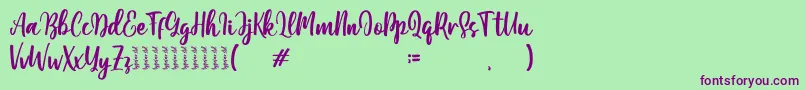 Moshinta Font – Purple Fonts on Green Background
