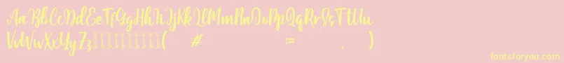Moshinta Font – Yellow Fonts on Pink Background
