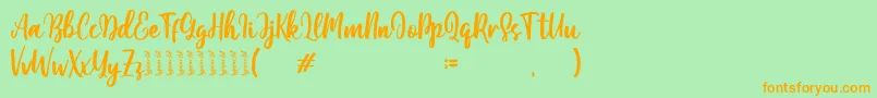 Moshinta Font – Orange Fonts on Green Background