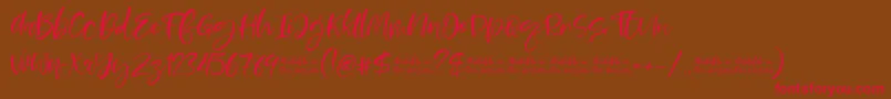 フォントMoskova – 赤い文字が茶色の背景にあります。