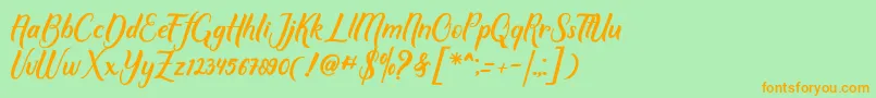 フォントMother love – オレンジの文字が緑の背景にあります。
