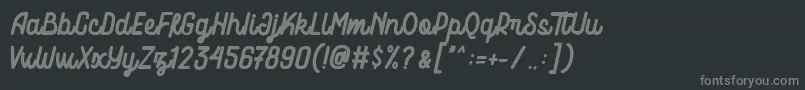 フォントMotowerks Demo – 黒い背景に灰色の文字
