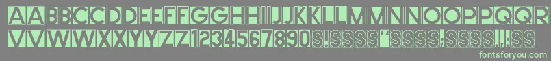 Cutmeout2-Schriftart – Grüne Schriften auf grauem Hintergrund