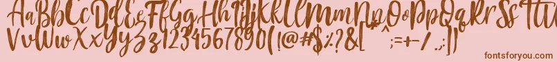 Fonte Mountain Script   Brush Font – fontes marrons em um fundo rosa