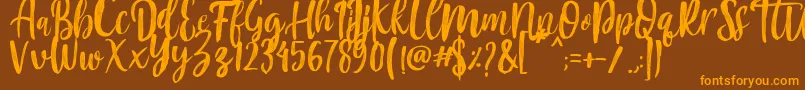 Mountain Script   Brush Font Font – Orange Fonts on Brown Background