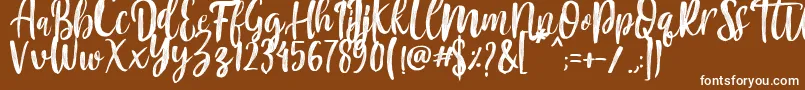 Czcionka Mountain Script   Brush Font – białe czcionki na brązowym tle