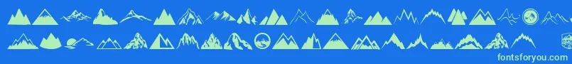 Mountain-Schriftart – Grüne Schriften auf blauem Hintergrund