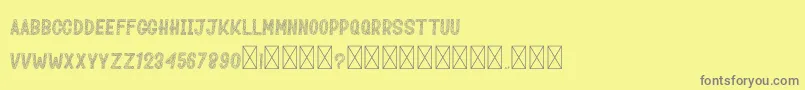 MozaikDuren-Schriftart – Graue Schriften auf gelbem Hintergrund
