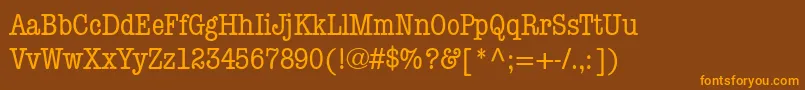 フォントItcAmericanTypewriterMediumCondensed – オレンジ色の文字が茶色の背景にあります。