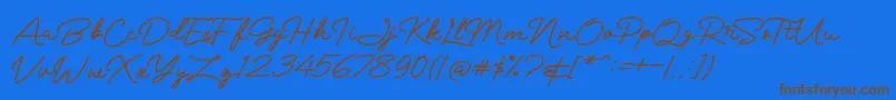 Mranggens Font – Brown Fonts on Blue Background