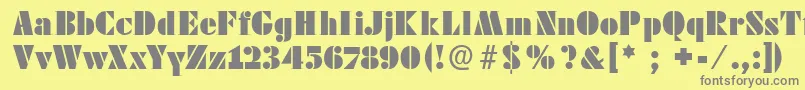 フォントFutstencilserif – 黄色の背景に灰色の文字