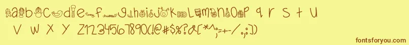 フォントMTFDearSanta – 茶色の文字が黄色の背景にあります。