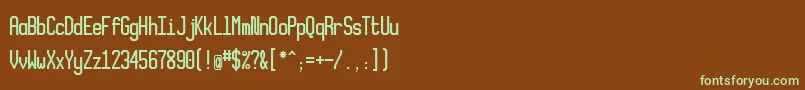 Xlmonoalt-Schriftart – Grüne Schriften auf braunem Hintergrund