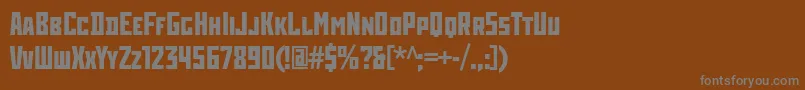 RodchenkoCondensedBold-fontti – harmaat kirjasimet ruskealla taustalla