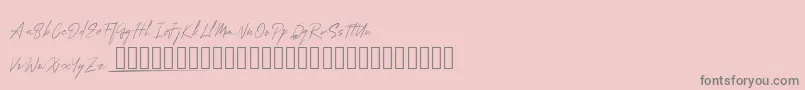 フォントMungSignature – ピンクの背景に灰色の文字