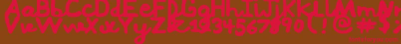 フォントMushi – 赤い文字が茶色の背景にあります。