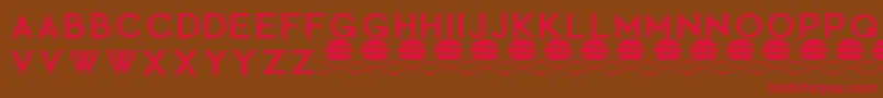 フォントCocopuffRegular – 赤い文字が茶色の背景にあります。