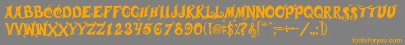 フォントMusicals – オレンジの文字は灰色の背景にあります。