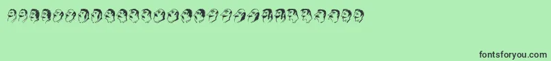 フォントMustachos – 緑の背景に黒い文字