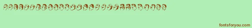 フォントMustachos – 緑の背景に茶色のフォント