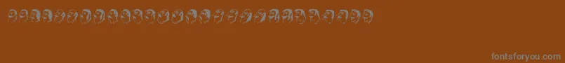 Czcionka Mustachos – szare czcionki na brązowym tle