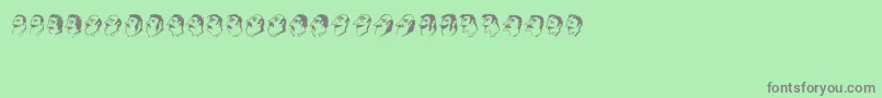 Mustachos-fontti – harmaat kirjasimet vihreällä taustalla