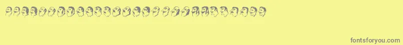 Mustachos-fontti – harmaat kirjasimet keltaisella taustalla