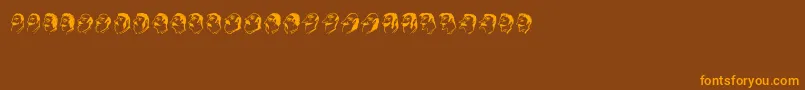 フォントMustachos – オレンジ色の文字が茶色の背景にあります。
