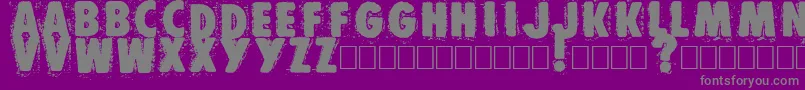 Muzo-fontti – harmaat kirjasimet violetilla taustalla