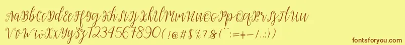 Fonte My Darling Script – fontes marrons em um fundo amarelo