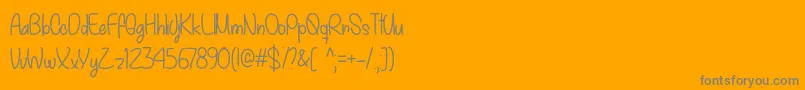 My December  -Schriftart – Graue Schriften auf orangefarbenem Hintergrund