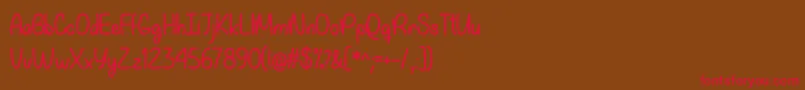 フォントMy Happy Ending   – 赤い文字が茶色の背景にあります。