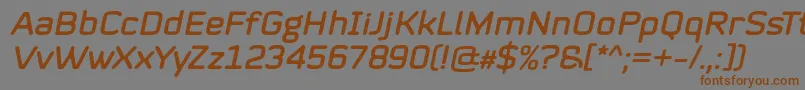 Mystag Italic Font by 7NTypes Font – Brown Fonts on Gray Background
