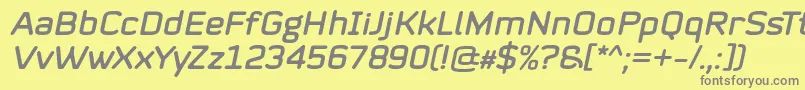 Mystag Italic Font by 7NTypes Font – Gray Fonts on Yellow Background