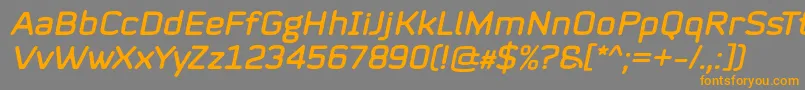 Mystag Italic Font by 7NTypes Font – Orange Fonts on Gray Background