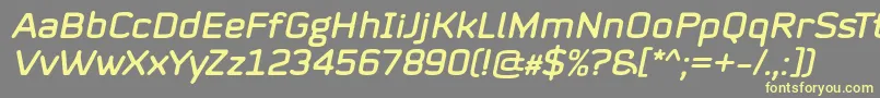 フォントMystag Italic Font by 7NTypes – 黄色のフォント、灰色の背景